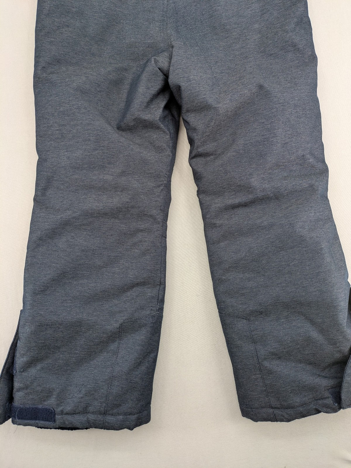 Topolino grey snow pants with adjustable straps and durable insulated material.