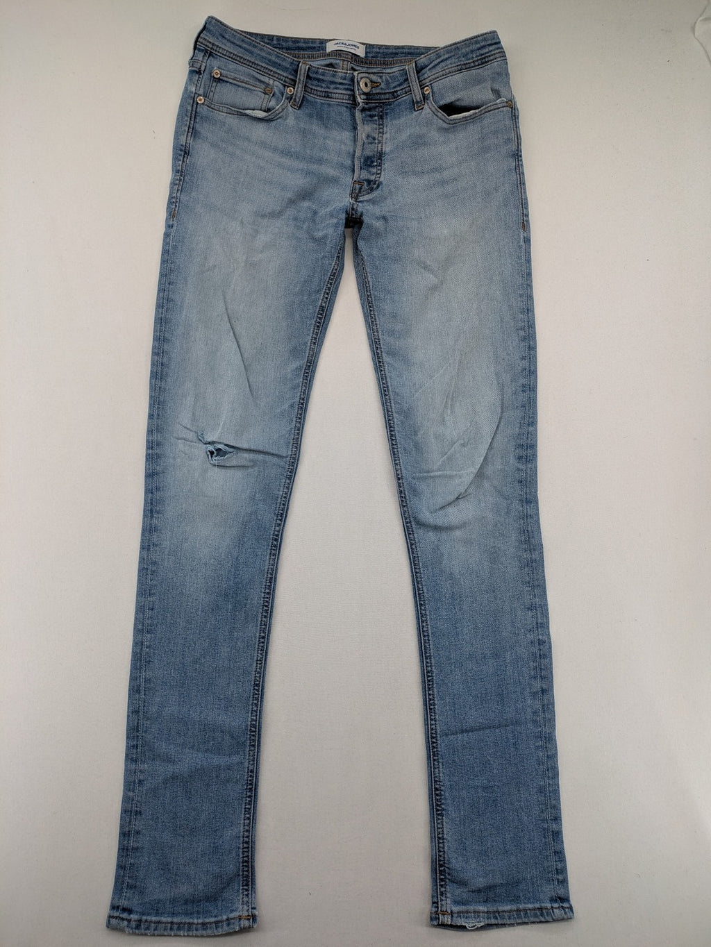Jack & Jones blue slim jeans with button fly and subtle used look.