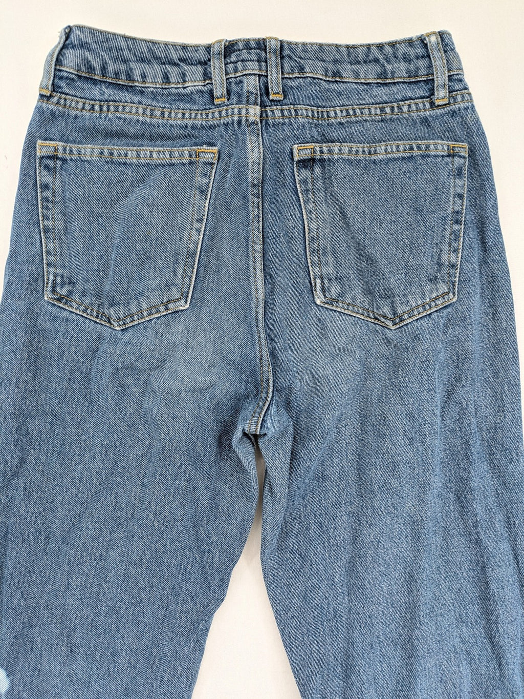 Castro Jeans blue straight leg jeans high waist with white paint splatter details.