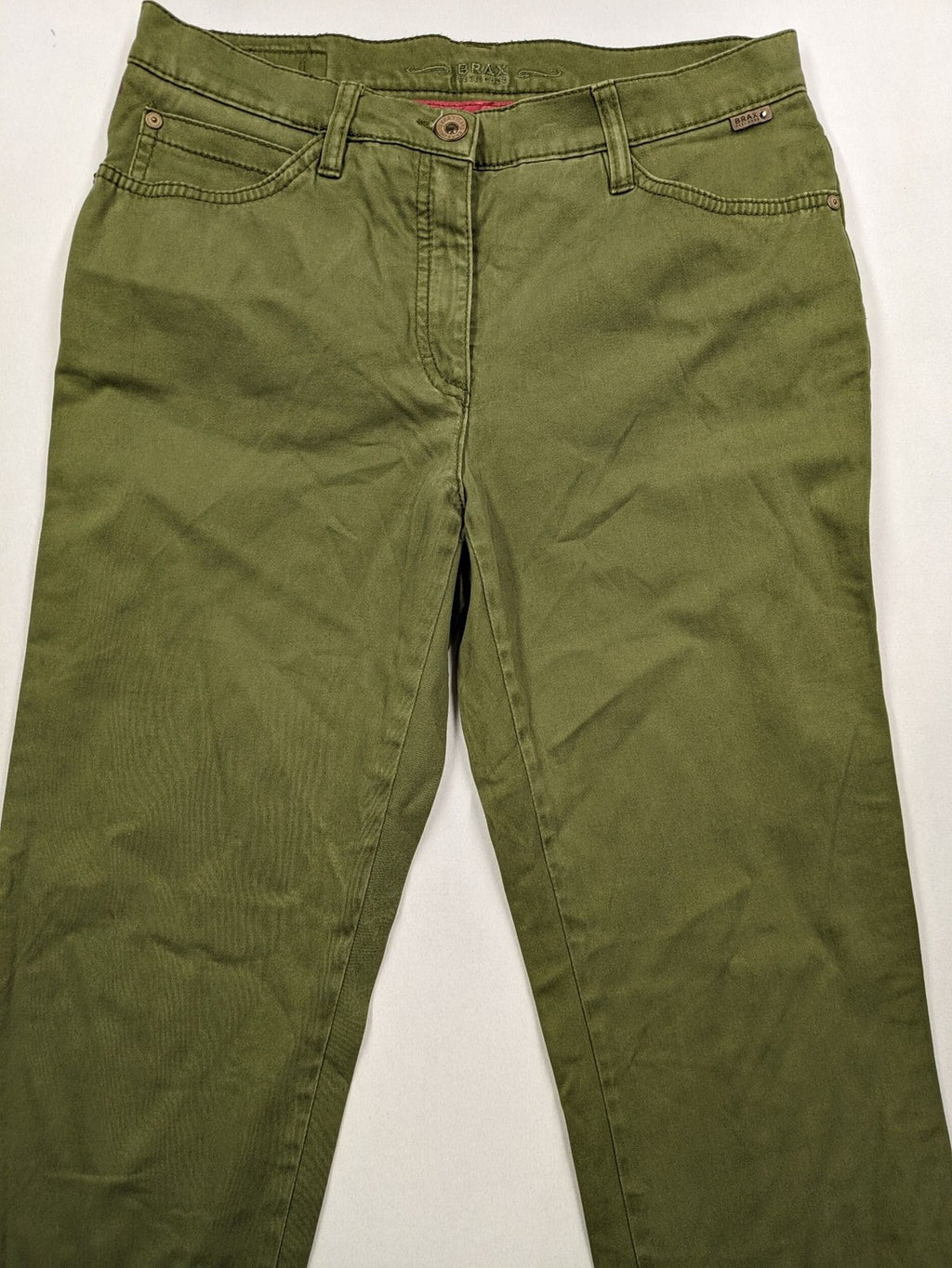 BRAX khaki pants classic five-pocket style with logo patch and zip button closure.