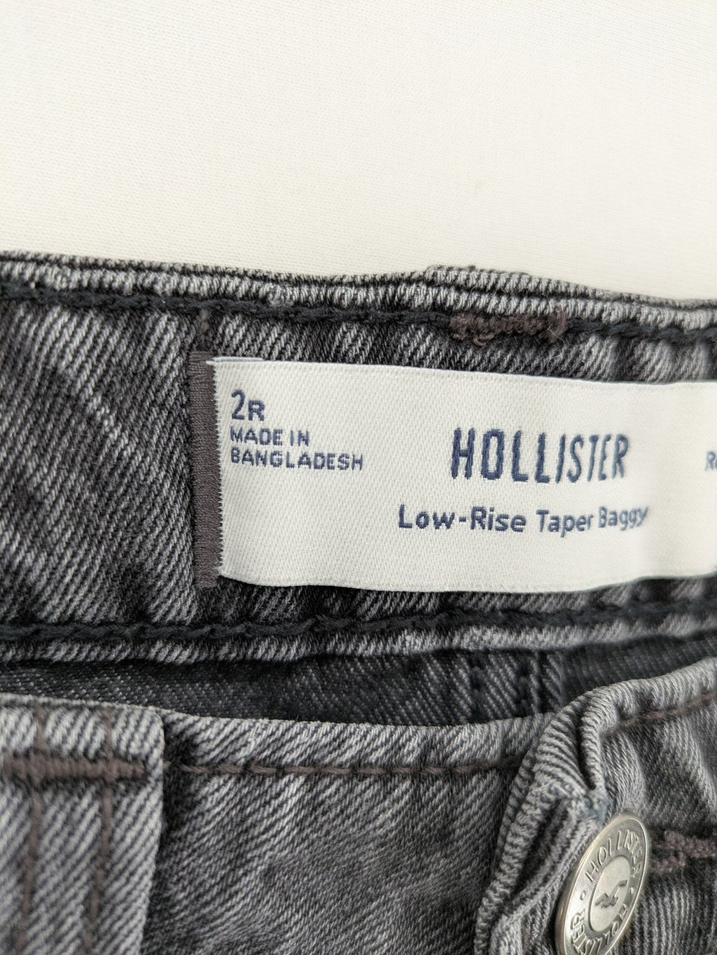 Hollister black tapered baggy jeans classic 5-pocket design with zipper and button closure.