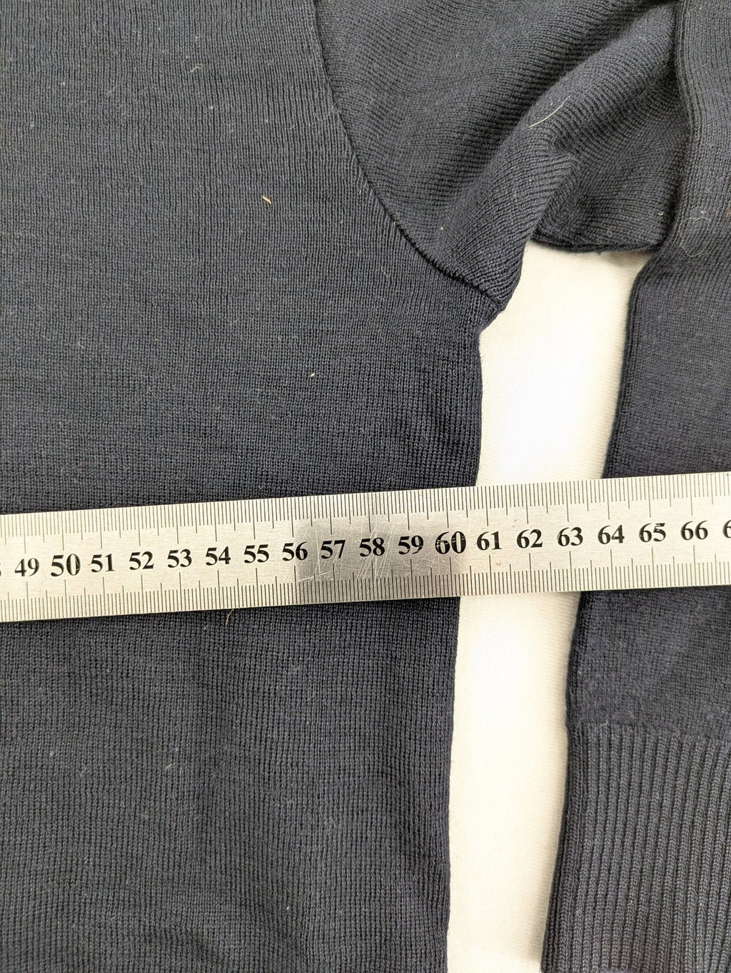 Dinovo grey knit jumper with ribbed roll neck and cuffs, made from merino wool blend.