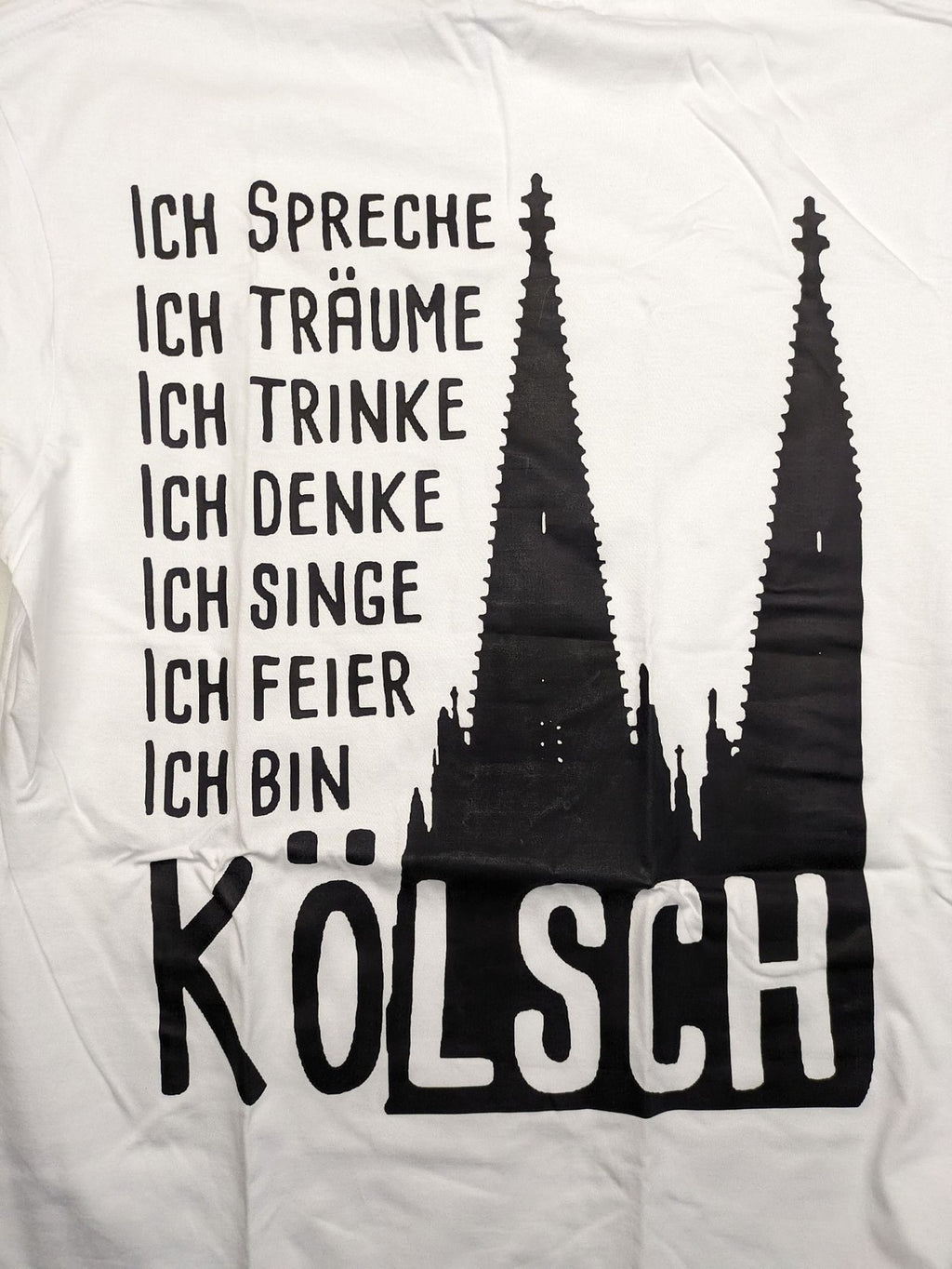JHK black t-shirt with red "Kölsche Jung" text and Cologne Cathedral graphic.