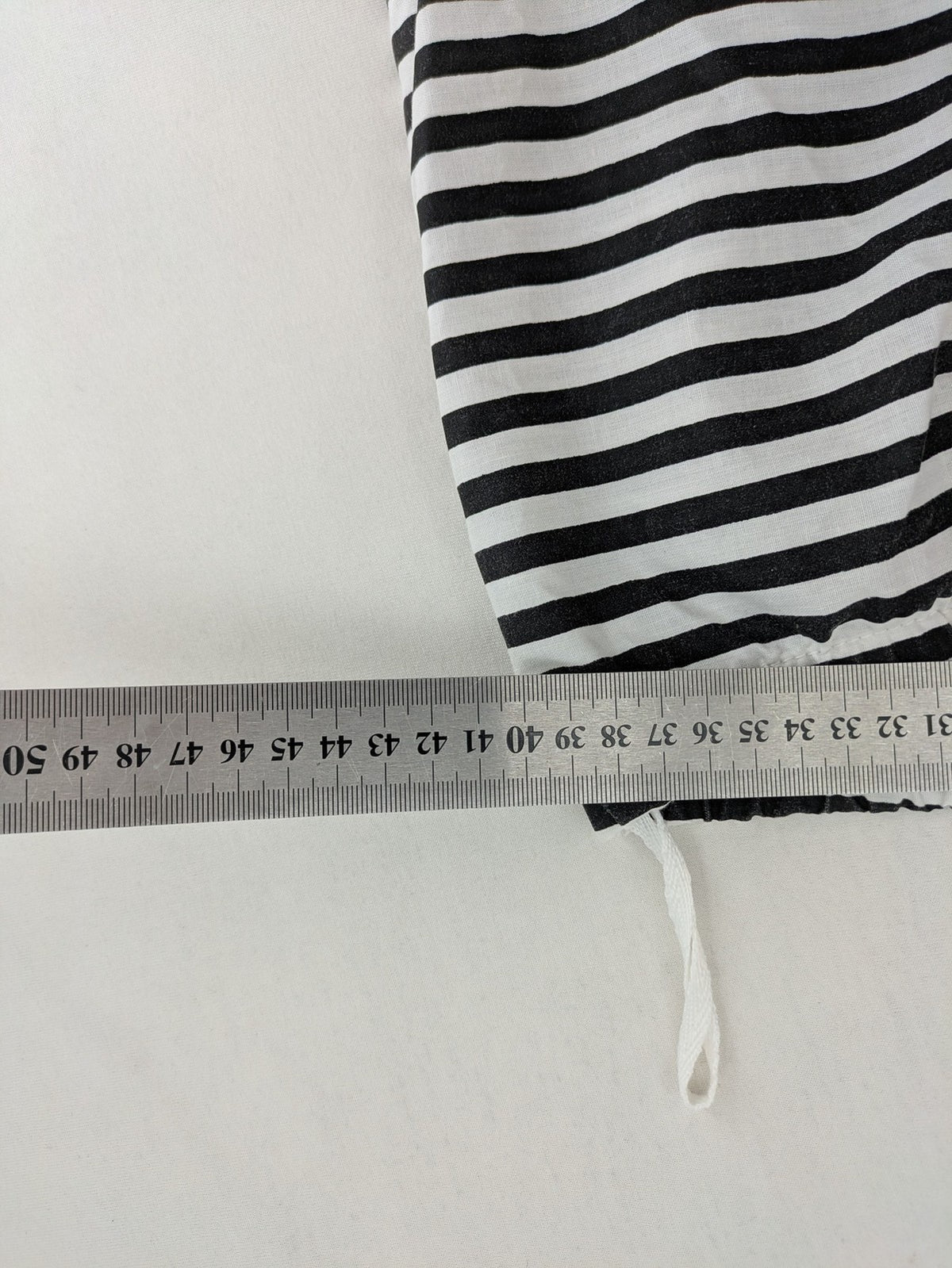 Rubie's costume set black and white striped with prisoner number patch on chest.
