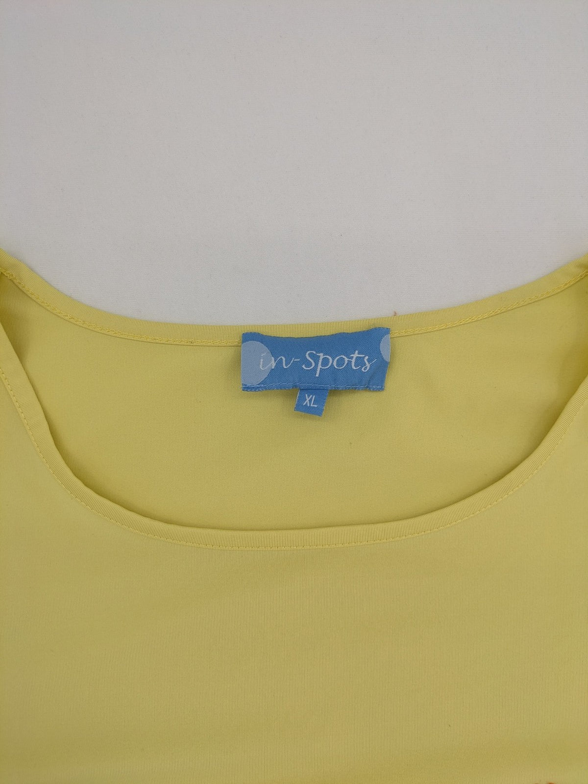 in-Spots yellow t-shirt with butterfly glitter graphic and textured bead details