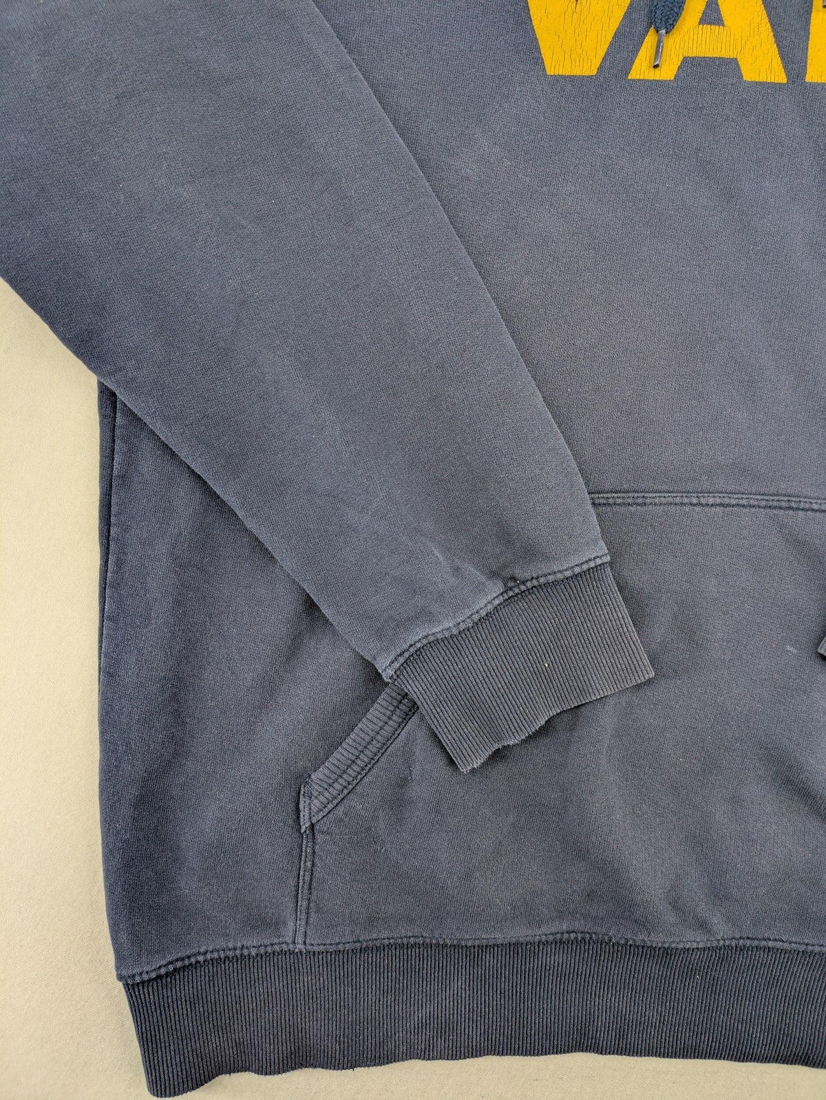 Vans zip-through hoodie navy blue with large yellow logo and kangaroo pocket.