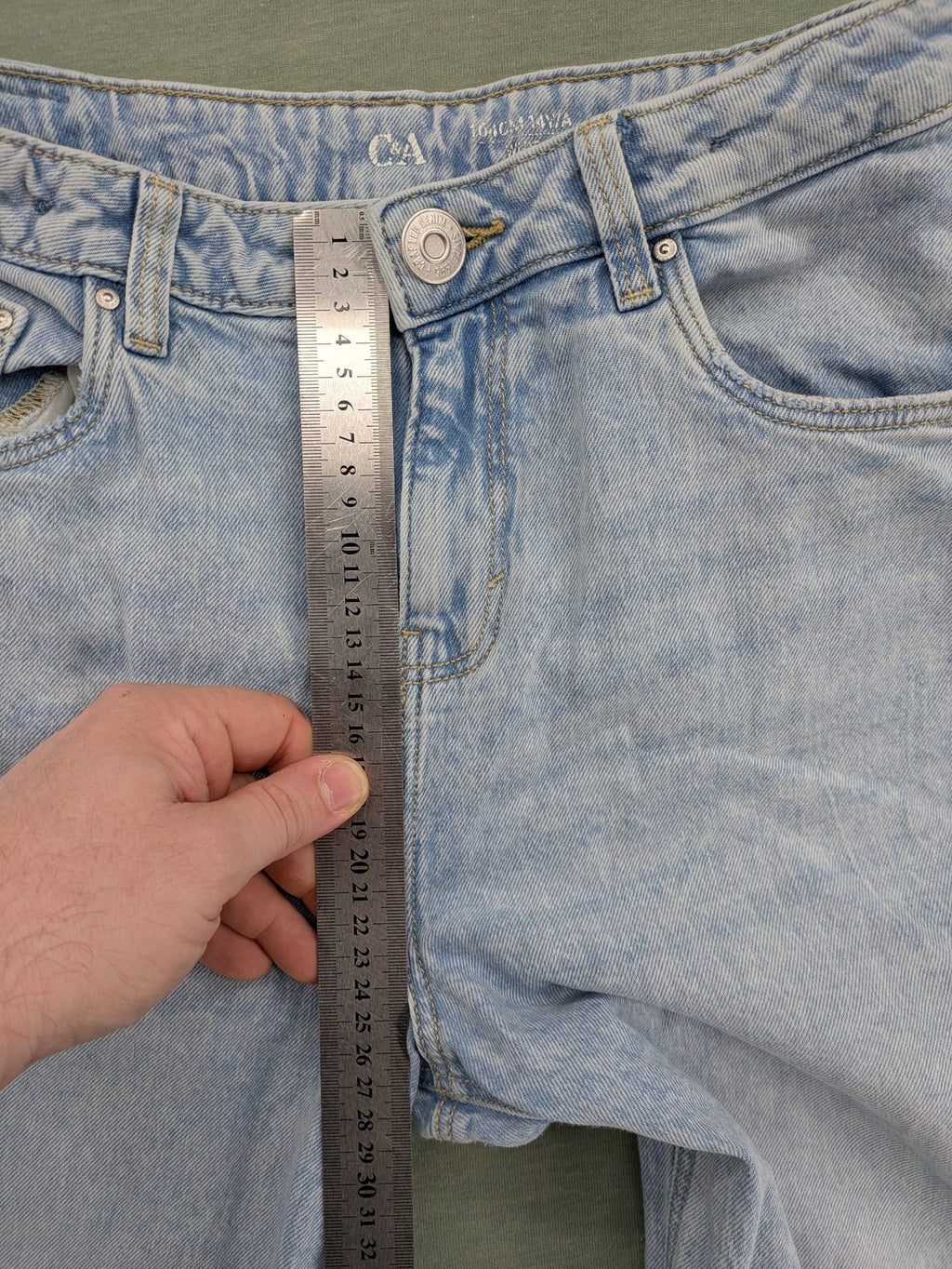 C&A blue wide leg jeans with distressed knee details and classic five-pocket design.