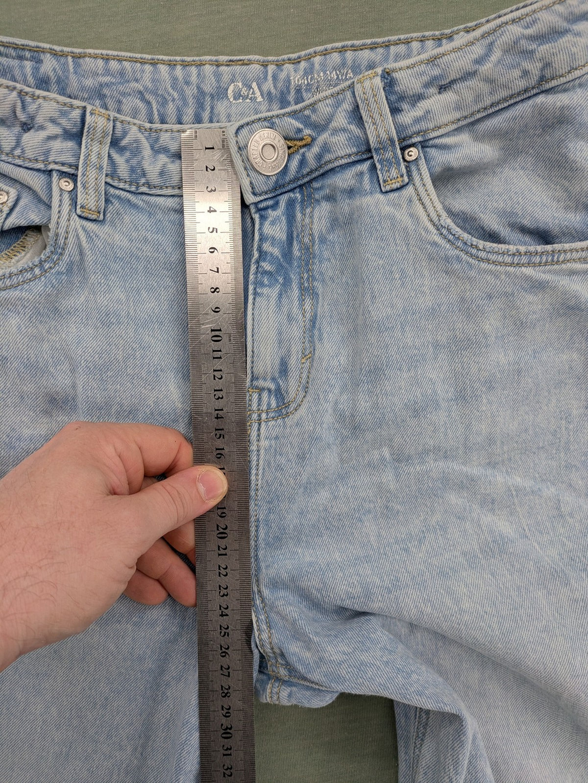C&A blue wide leg jeans with distressed knee details and classic five-pocket design.