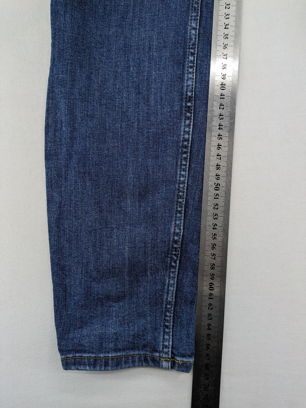 H&M blue skinny jeans with stretch denim and slim fit design.