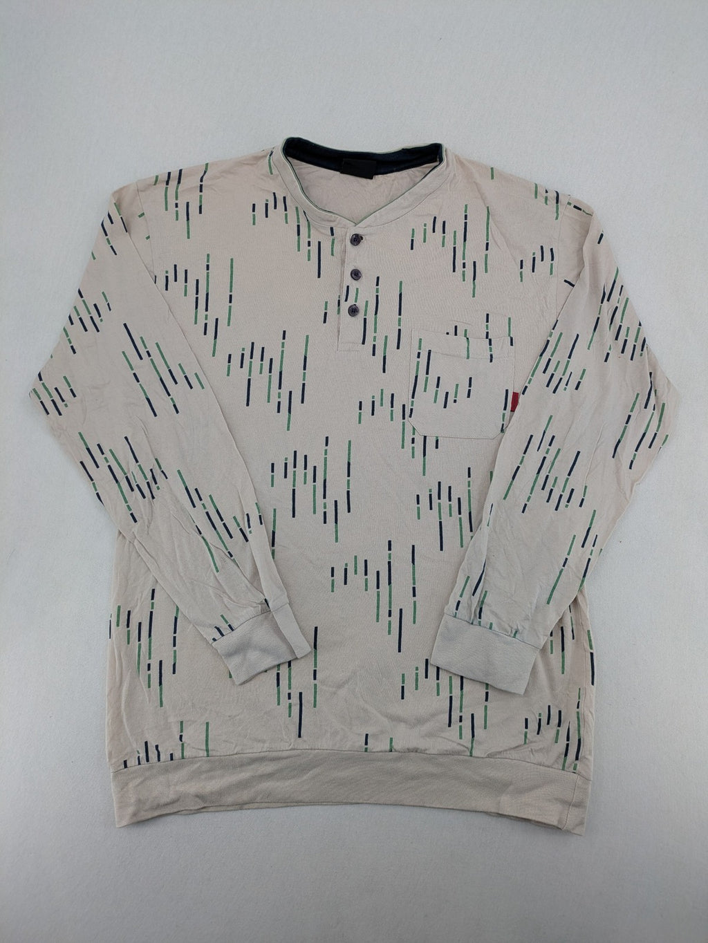 Normann beige striped long sleeve Henley shirt with button placket and chest pocket.