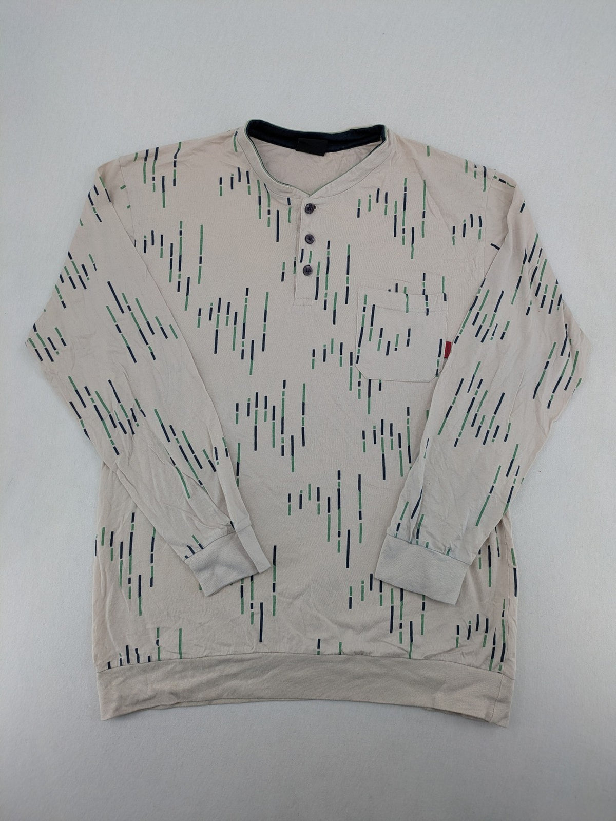 Normann beige striped long sleeve Henley shirt with button placket and chest pocket.