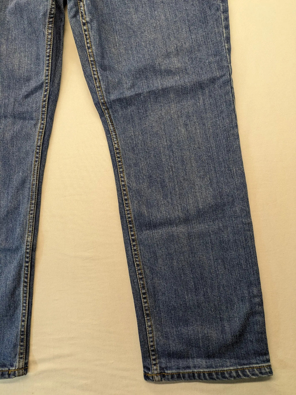 Hero By John Meddox blue straight jeans with five-pocket design and zip fly.