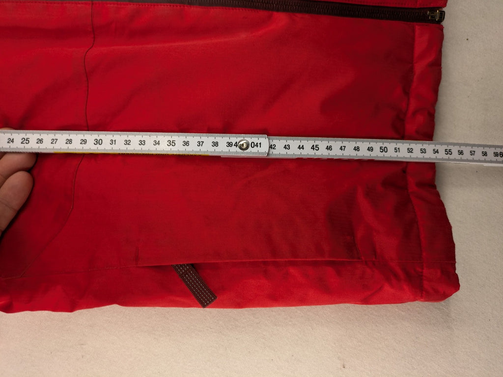 Patagonia red winter coat with hood, zip closure, snow skirt, and ski pass pocket.