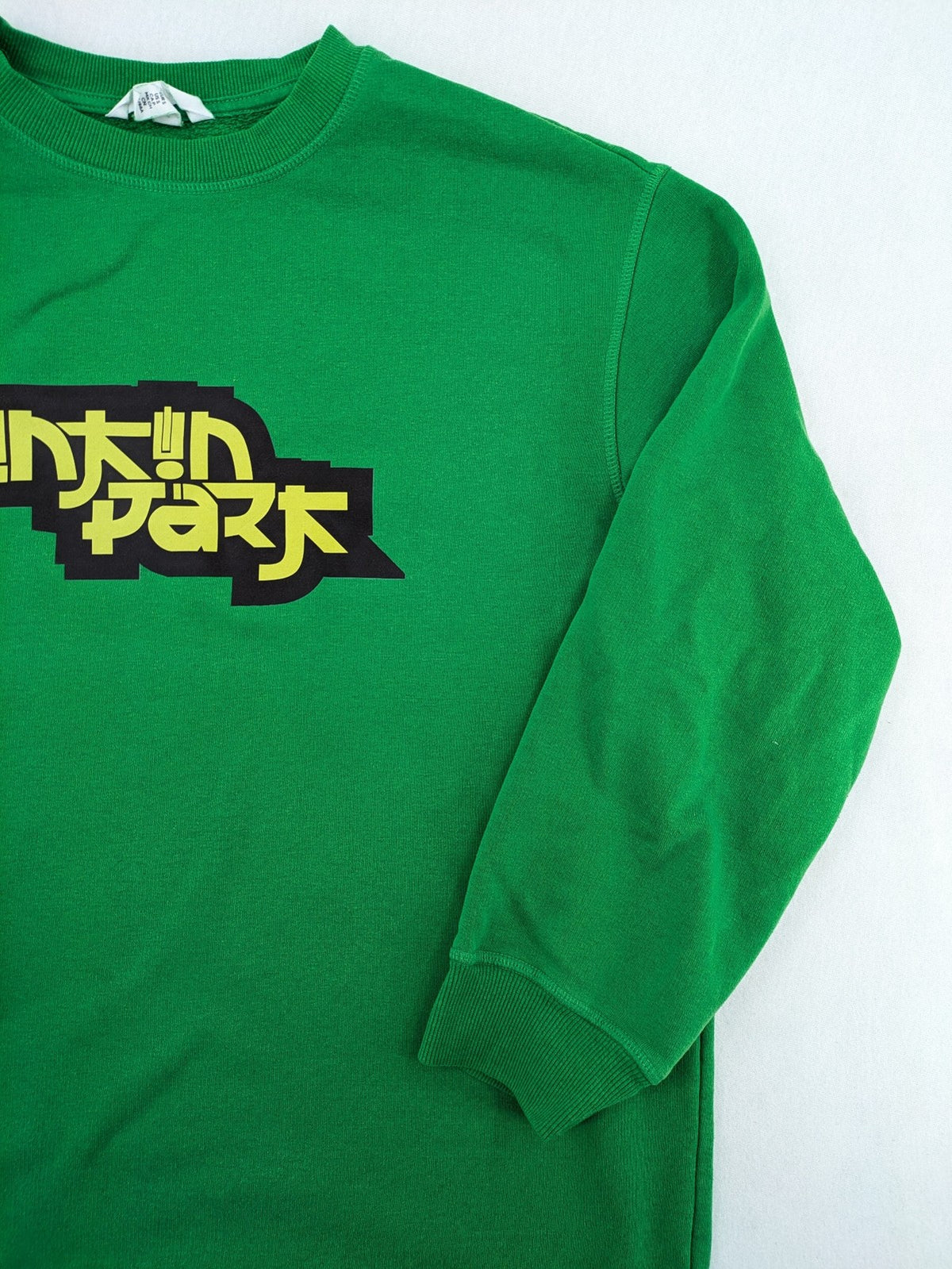 Linkin Park green sweatshirt featuring iconic band logo and classic crew neck design.
