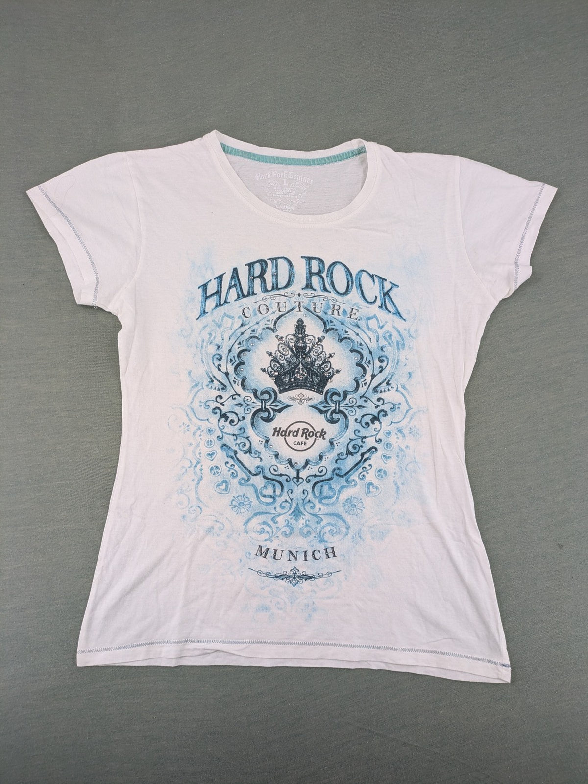 Hard Rock Cafe blue and white T-shirt with crown graphic and rhinestone accents.