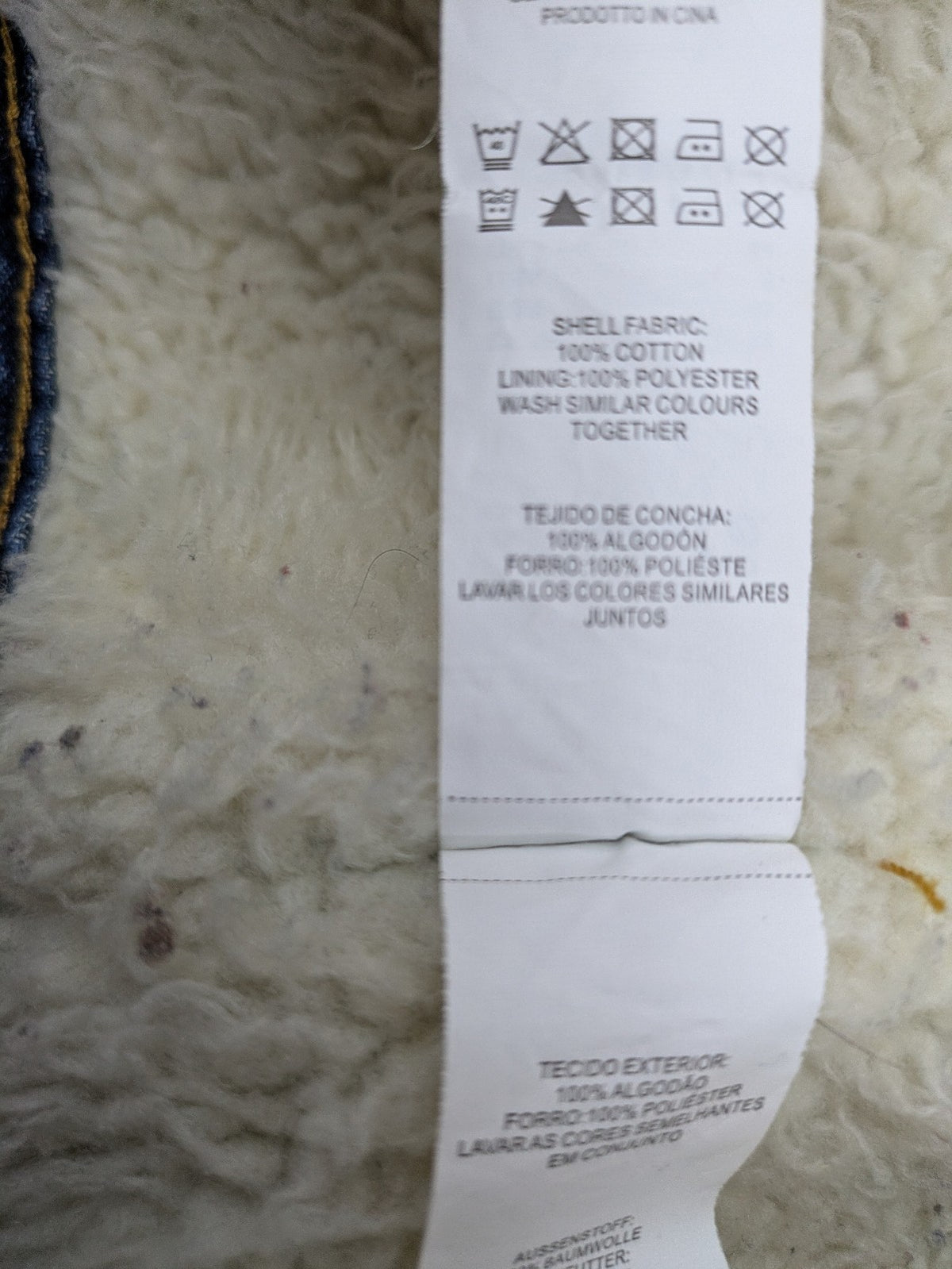 Denim & Co. blue jacket with cream Sherpa lining, button closure, and pockets.