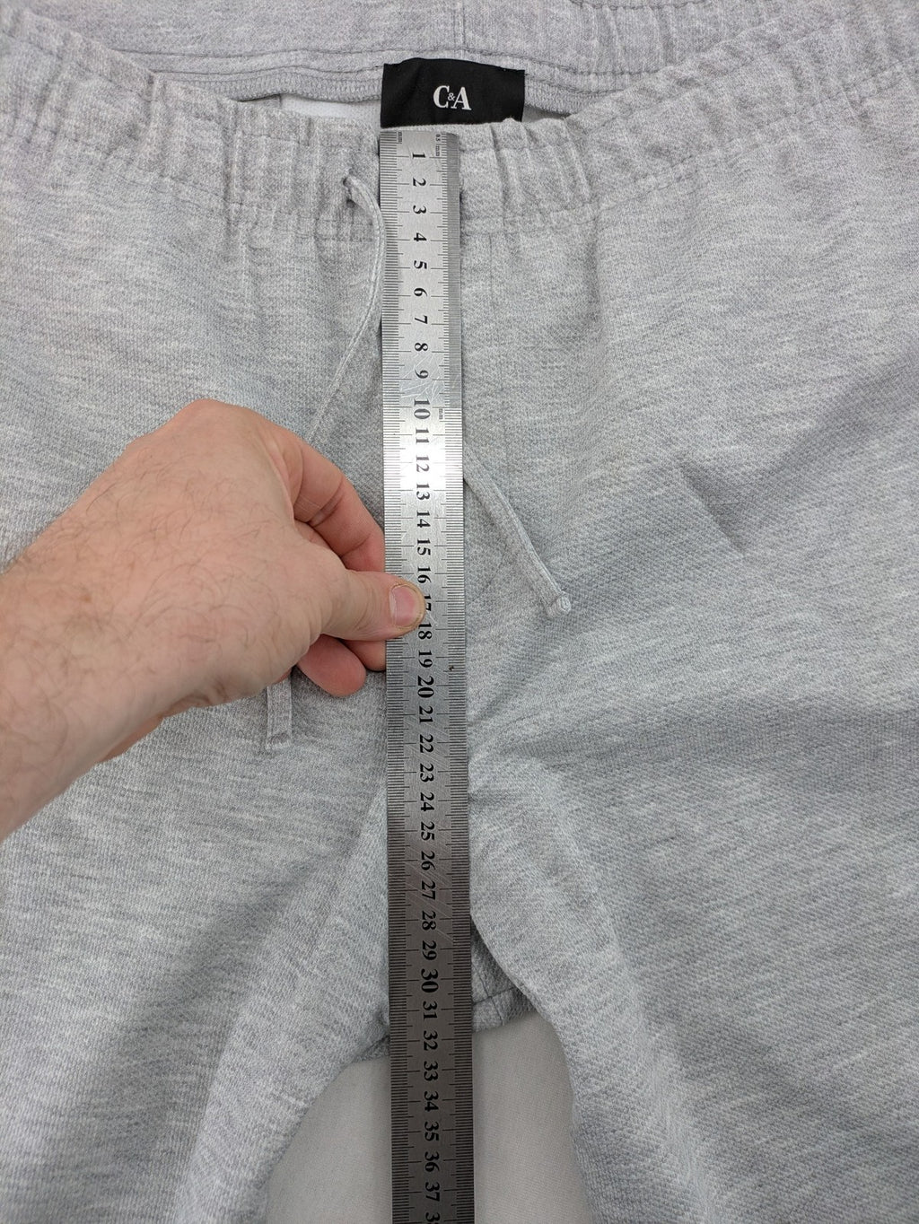 C&A grey sweatpants with elastic waistband, adjustable drawstring, and side pockets.