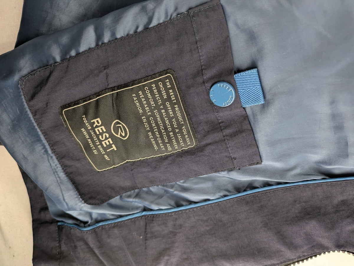 Reset navy parka jacket windproof with adjustable hood and zippered chest pocket.