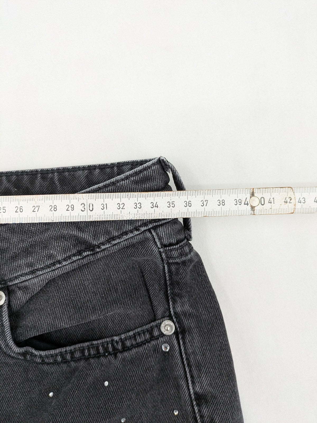H&M Divided black straight jeans with allover rhinestone embellishments and classic five-pocket design.