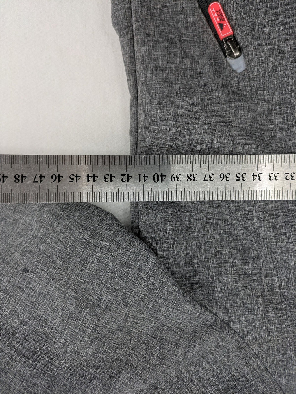 Northville grey and red softshell jacket with hood, fleece lining, and reflective elements.