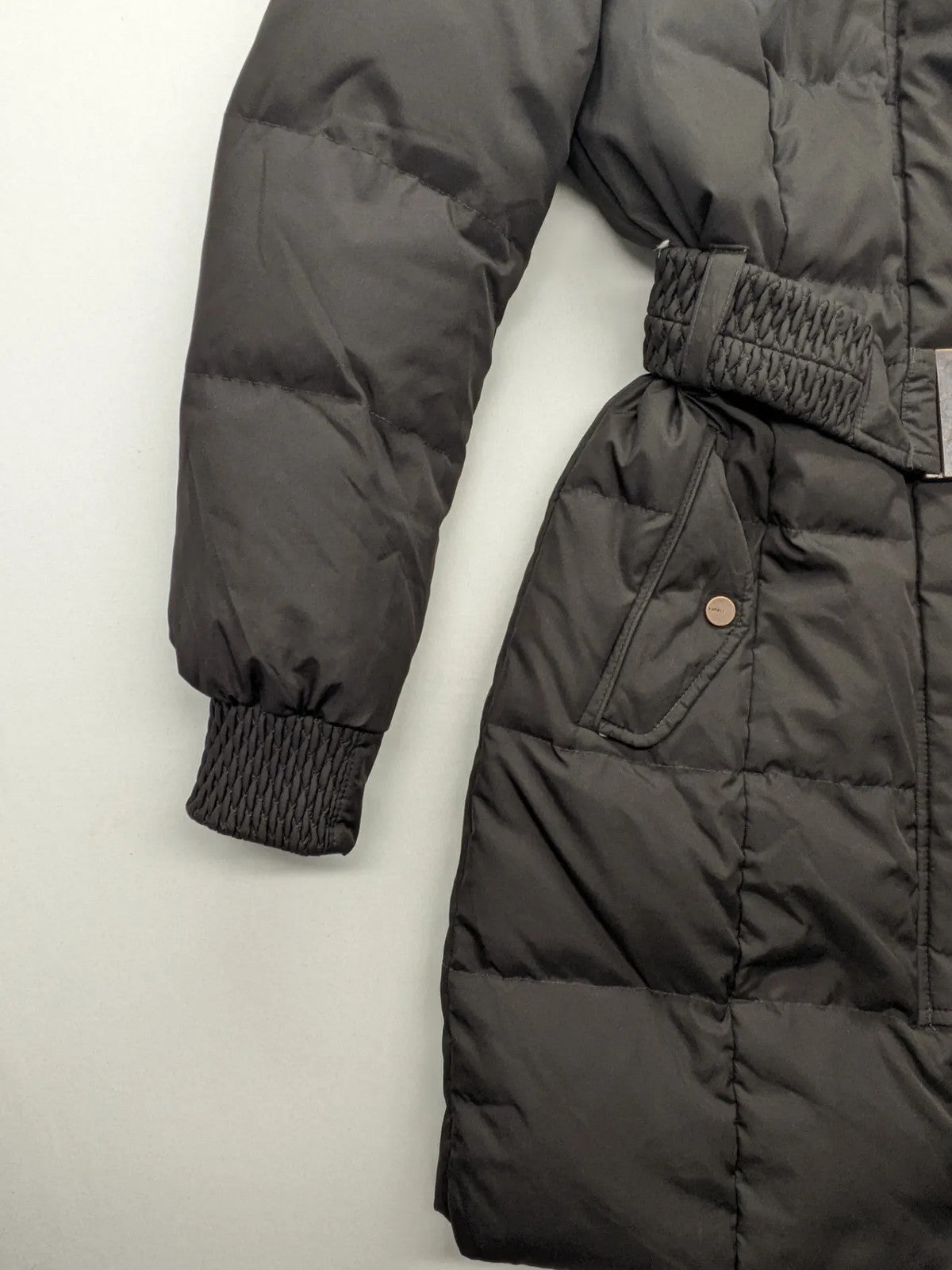 Esprit black quilted coat with removable faux fur hood and elastic waist belt.