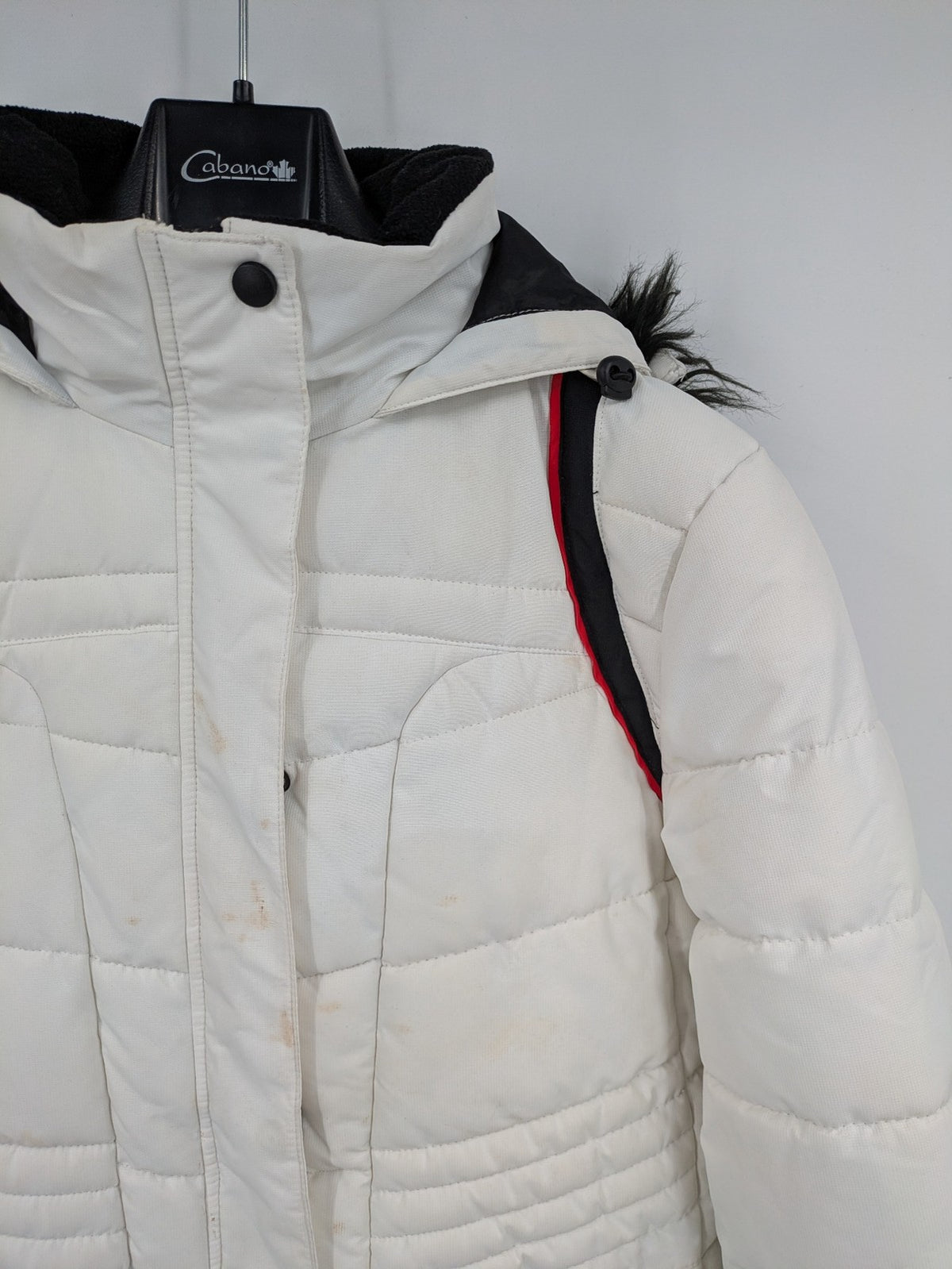Janina white puffer jacket with quilted design and faux fur hood accents.