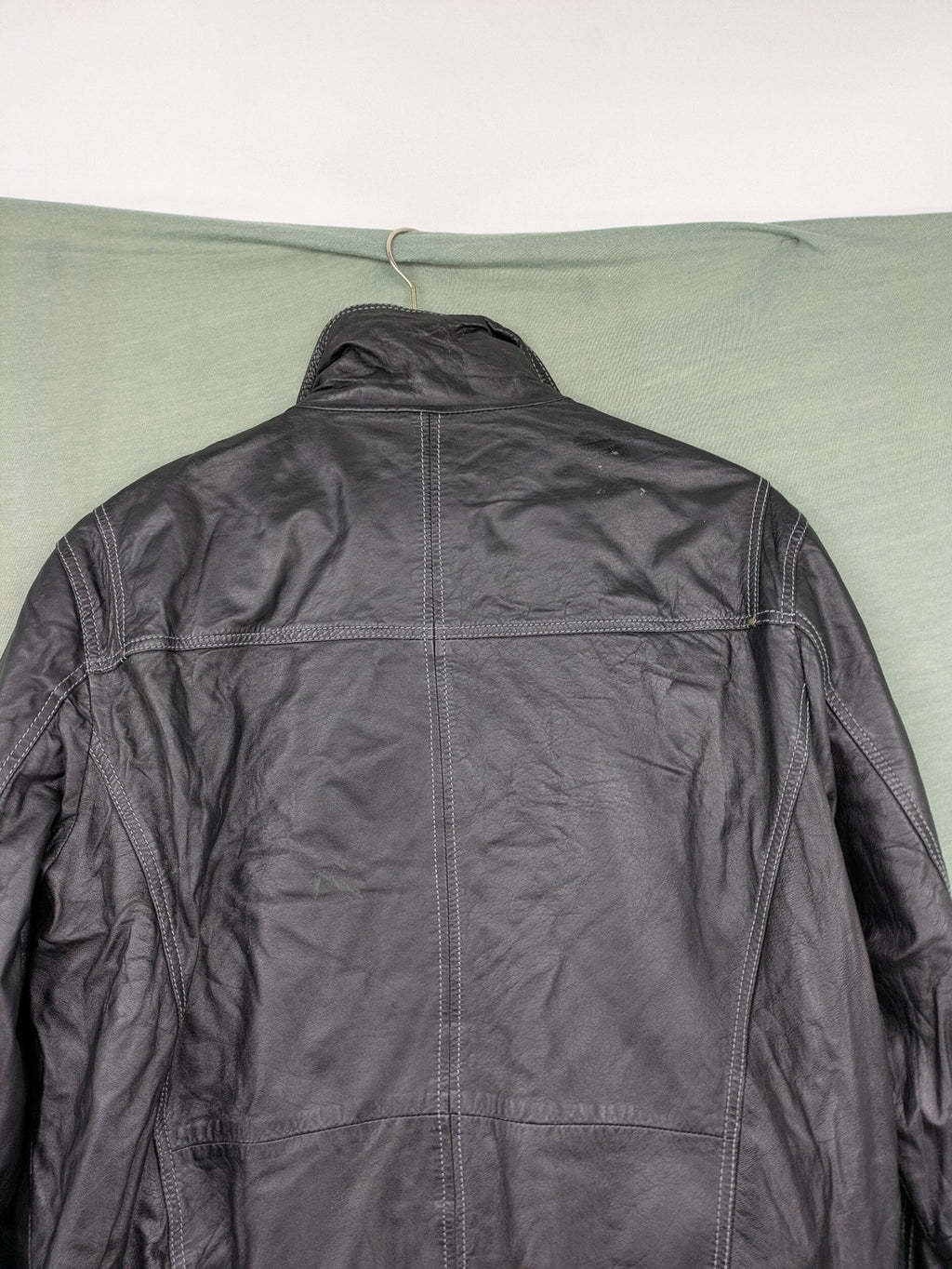 Tom Tailor black leather jacket vintage style with multiple pockets and contrast stitching.