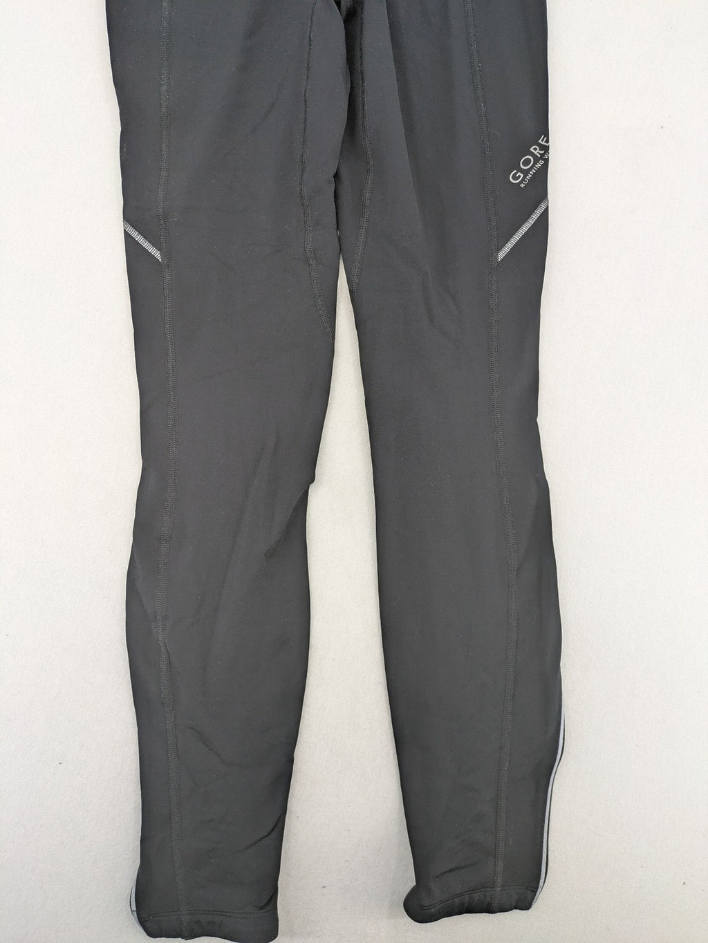 GORE RUNNING WEAR black bicycle tights with reflective details and zippered ankle openings.