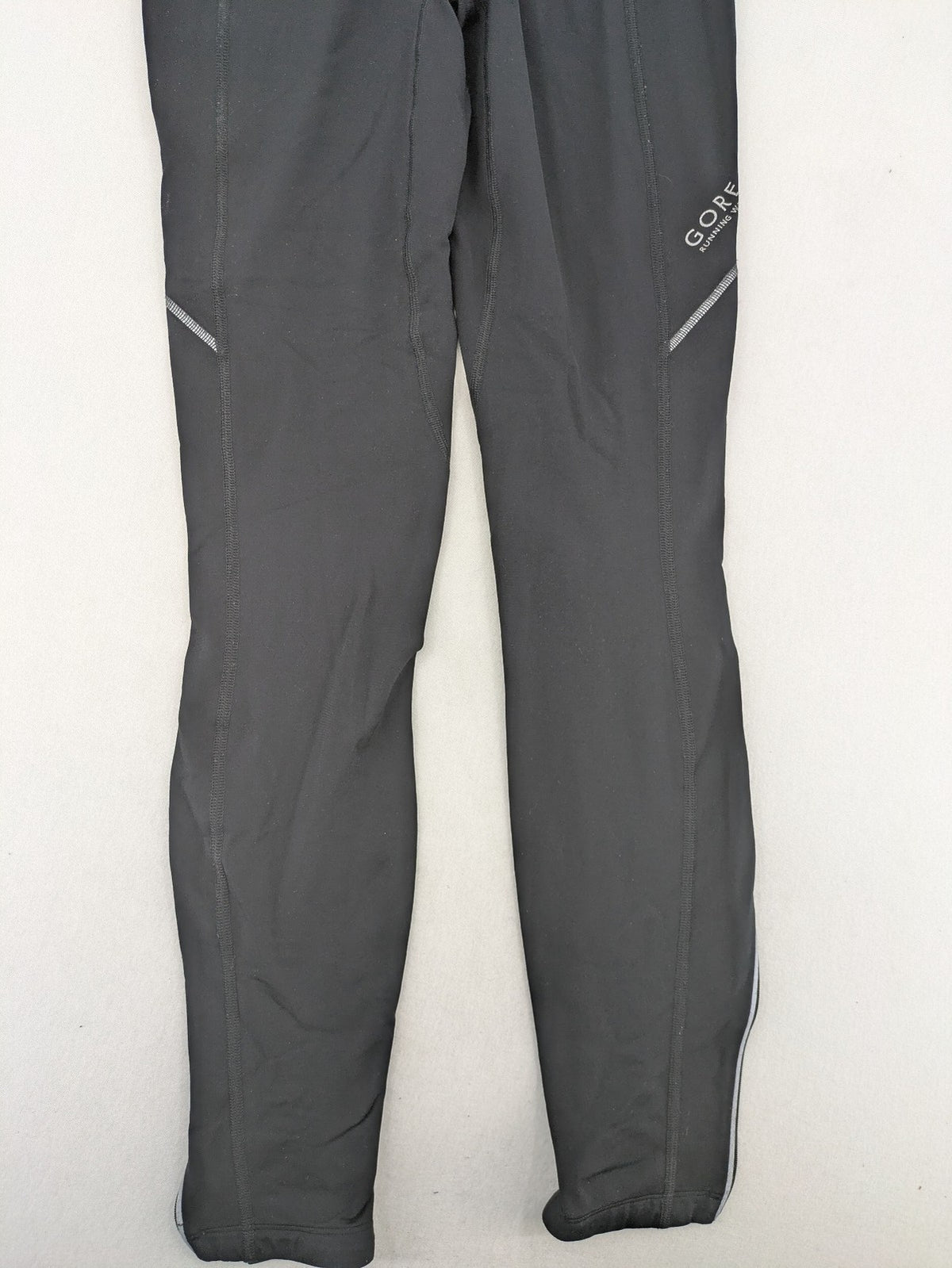 GORE RUNNING WEAR black bicycle tights with reflective details and zippered ankle openings.