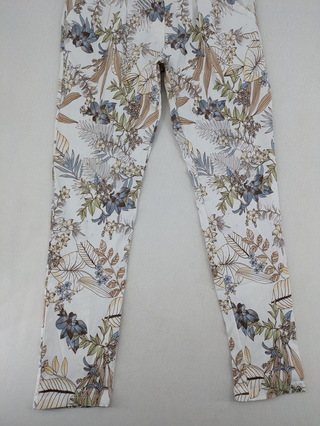 Made in Italy multi pants tropical floral pattern cotton-viscose blend on white background.