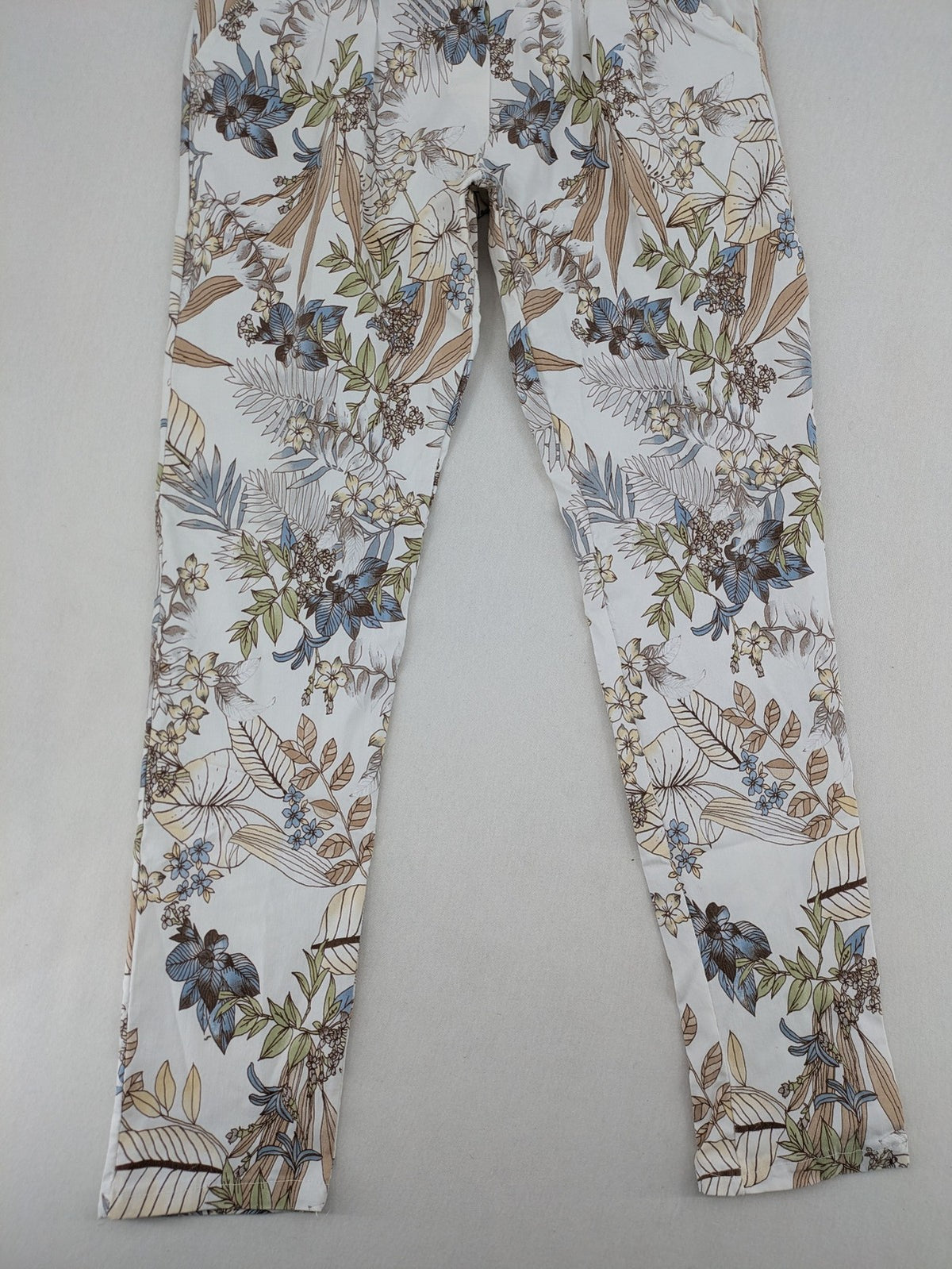 Made in Italy multi pants tropical floral pattern cotton-viscose blend on white background.