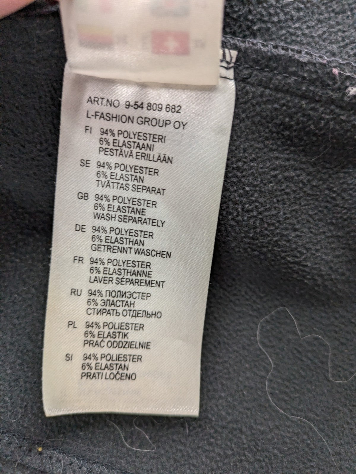 Icepeak black softshell jacket with fleece lining, adjustable hood, and zippered pockets.