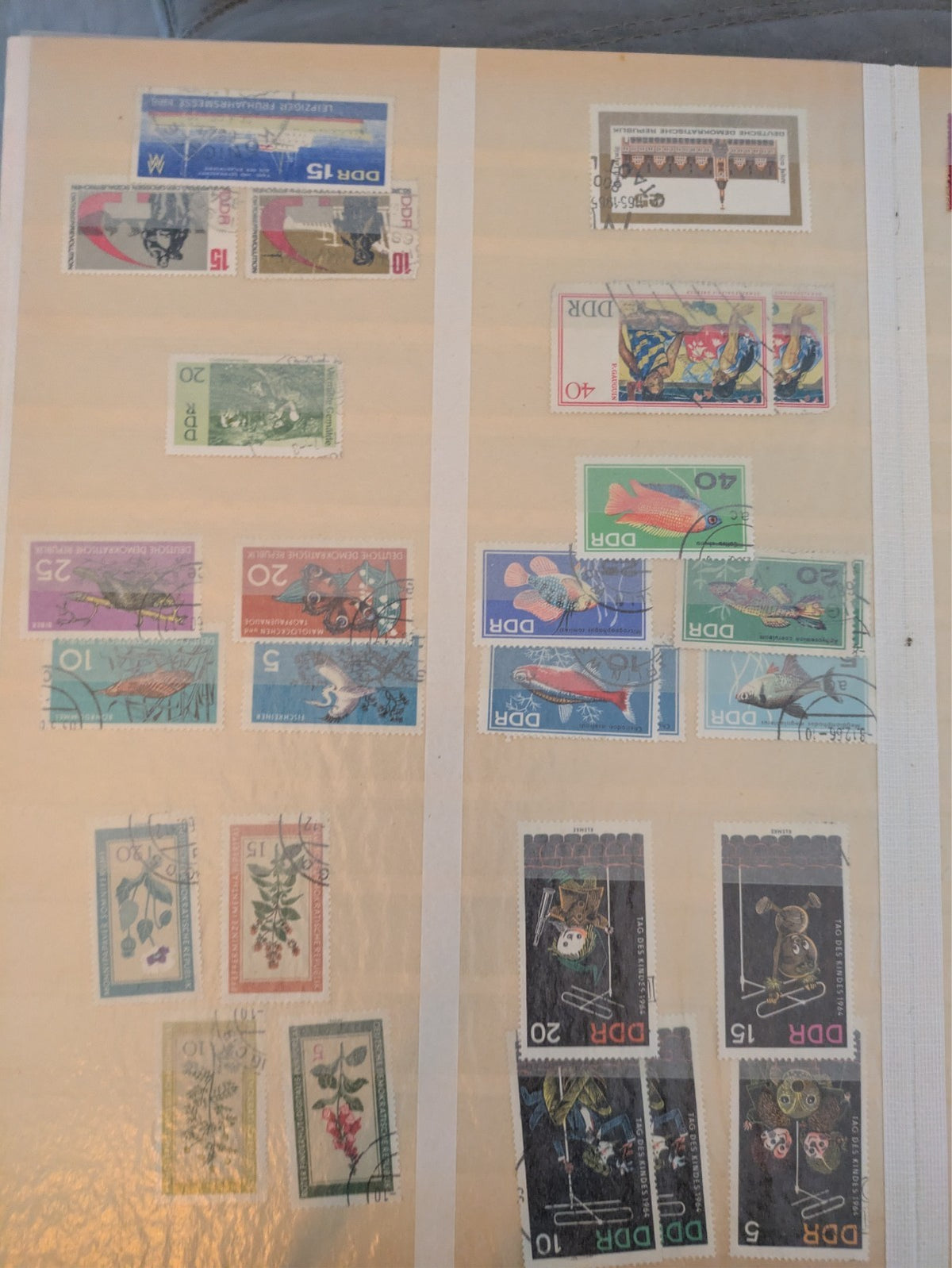 Beige postage stamp album featuring over 1000 stamps from Germany and Europe.