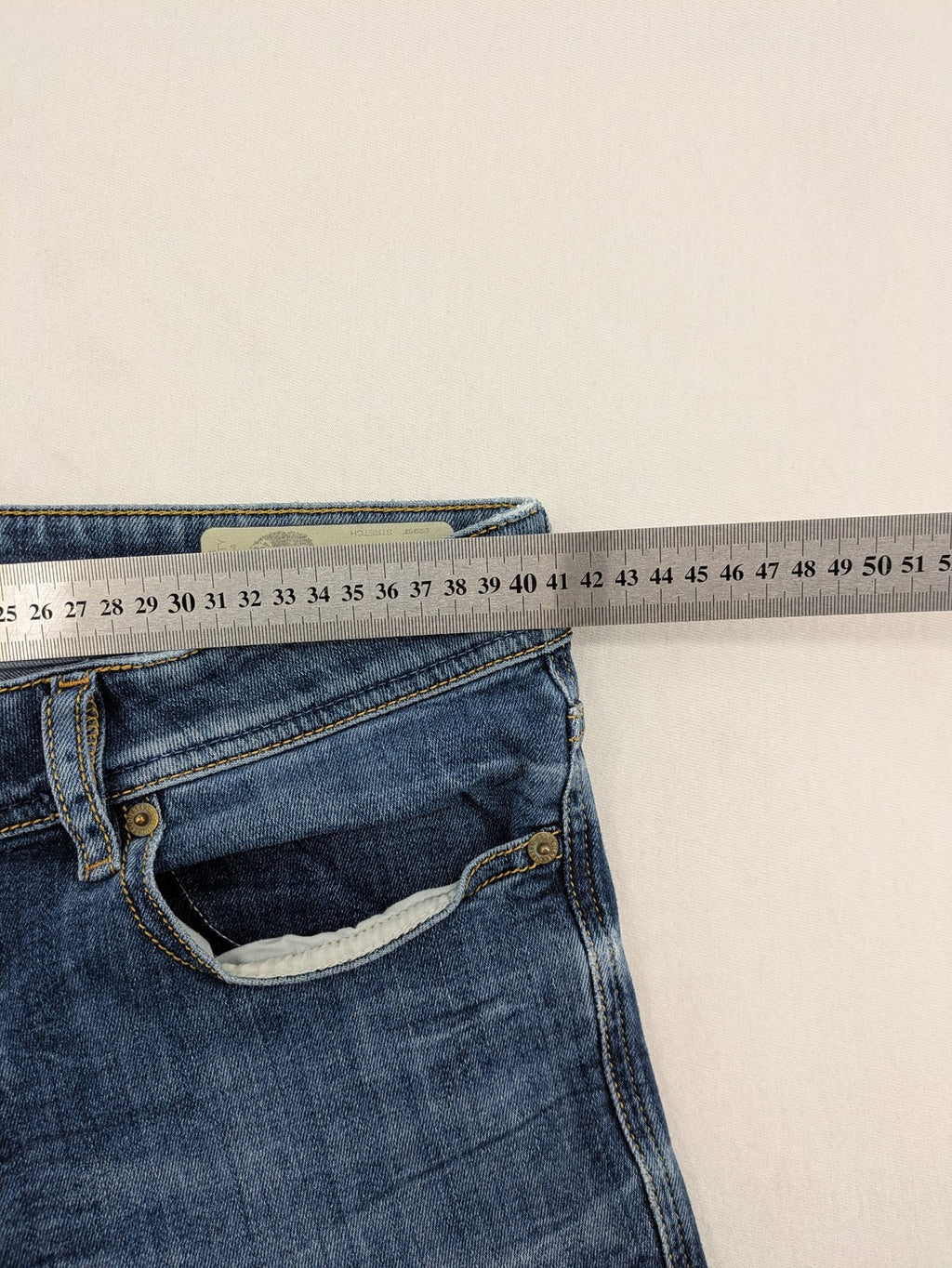 Diesel blue slim skinny jeans with logo patch and stretch denim material.
