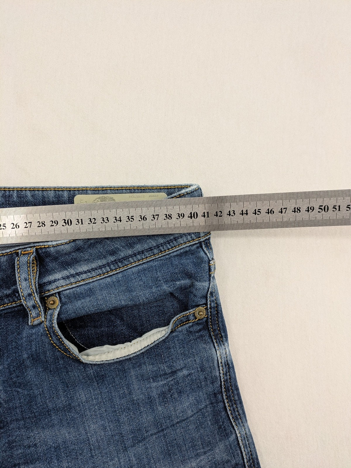 Diesel blue slim skinny jeans with logo patch and stretch denim material.