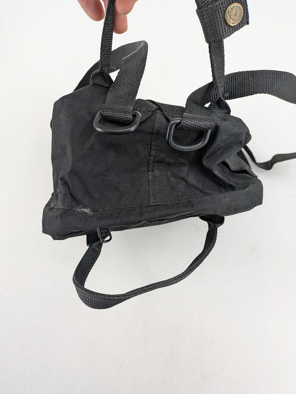 Fjällräven Kånken Mini rucksack black durable fabric with logo and zippered main compartment.