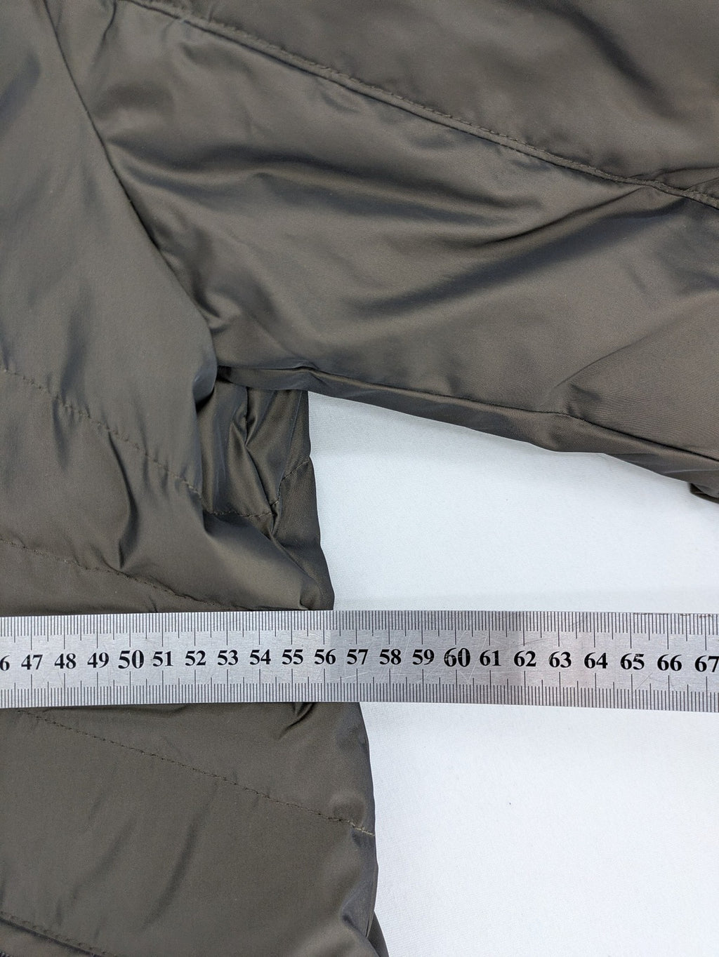 Gerry Weber Edition grey quilted coat with faux fur collar and metal toggle closures.
