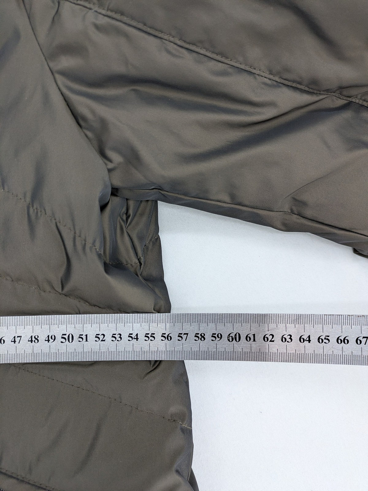 Gerry Weber Edition grey quilted coat with faux fur collar and metal toggle closures.