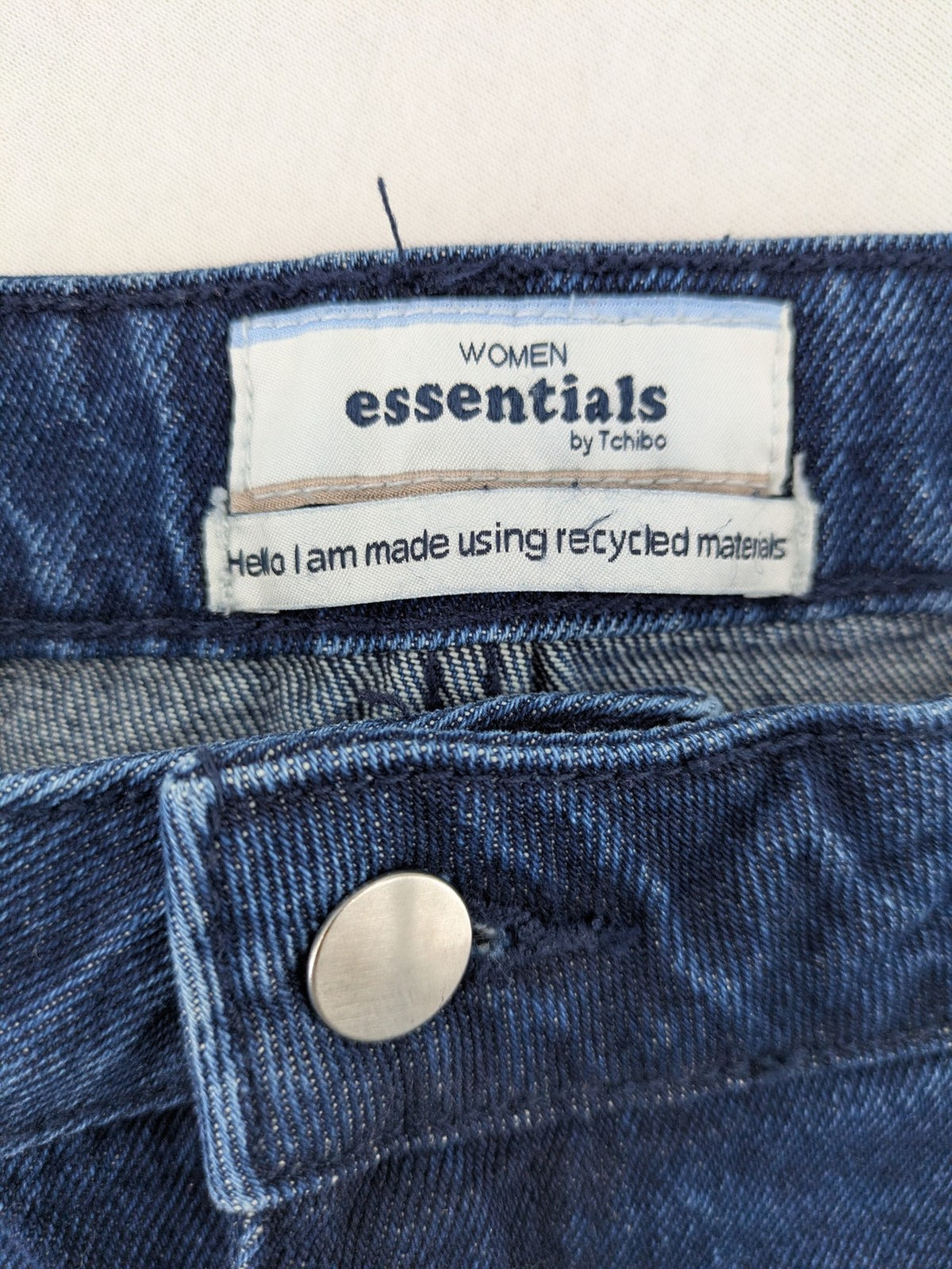 Tchibo blue straight jeans with five-pocket design and wide leg cut in durable cotton.