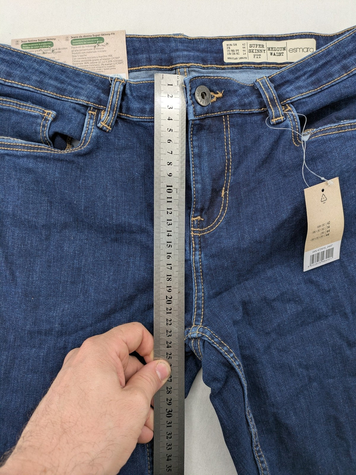 ESMARA blue super skinny jeans with dark wash and stretch denim material.