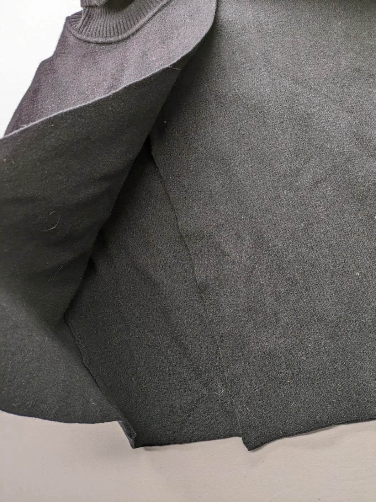 In Shape grey turtle neck jumper asymmetrical design, soft viscose blend material.