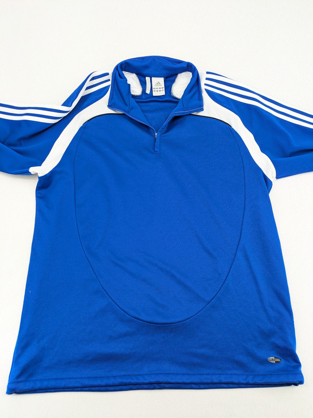 Adidas blue long sleeve top with white three stripes and 1/4 zip collar.