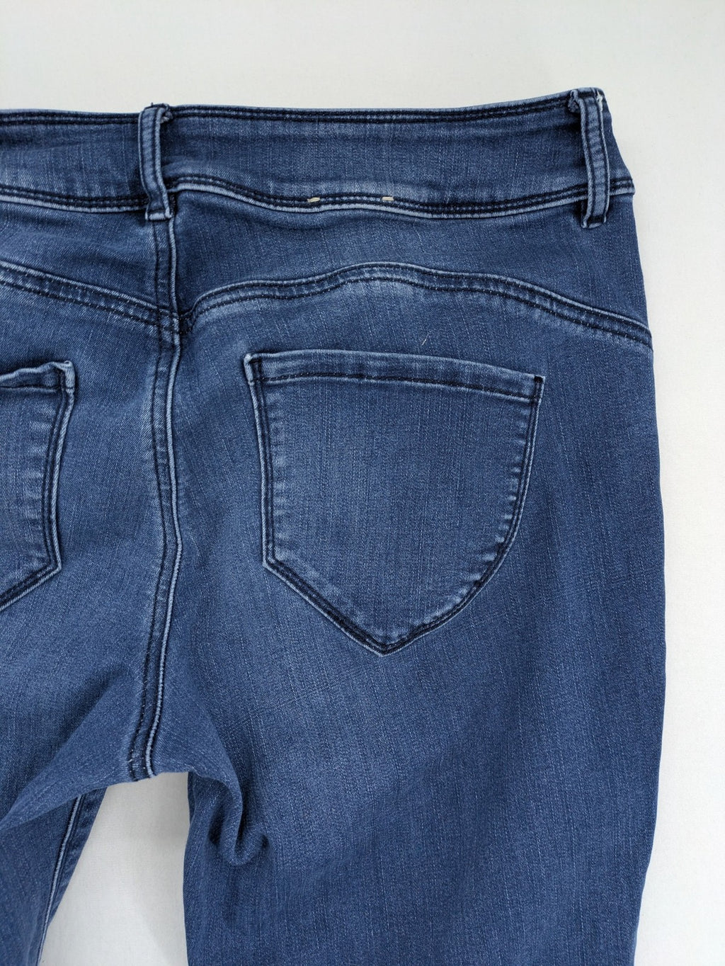Tom Tailor blue skinny jeans with classic 5-pocket design and double button closure.