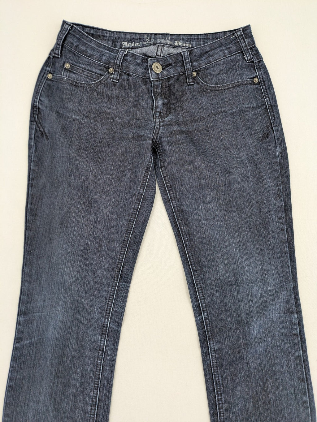 Review straight leg jeans dark blue low rise stretch denim with classic design.