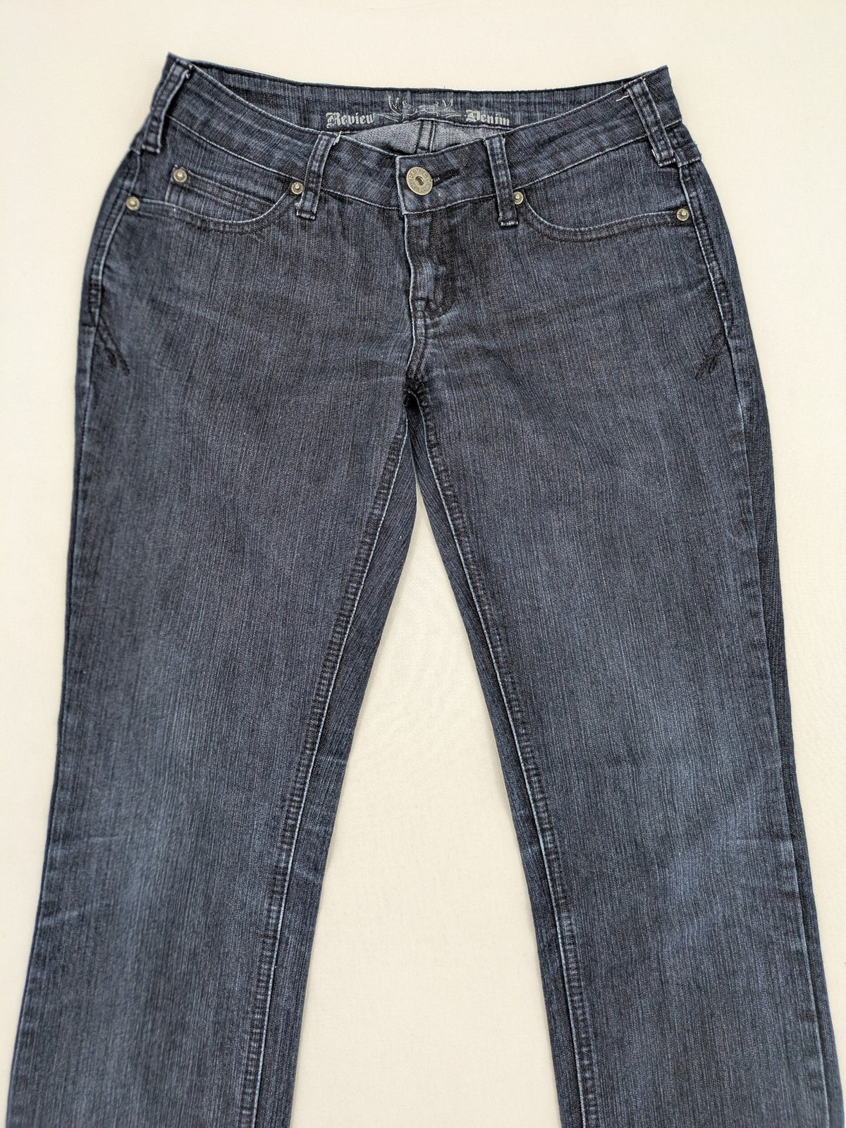 Review straight leg jeans dark blue low rise stretch denim with classic design.