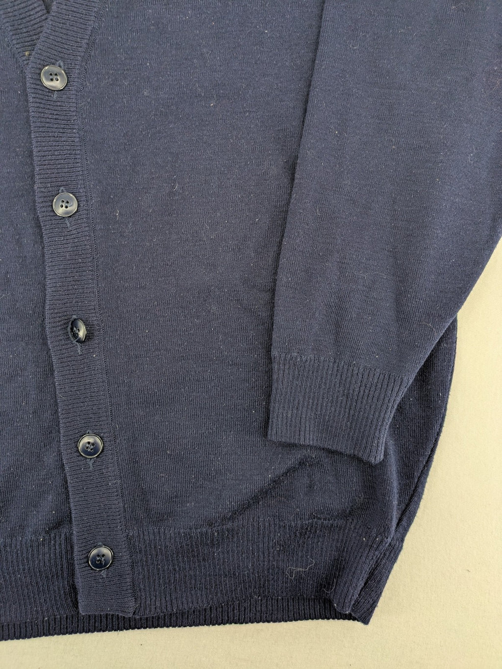 Schurwolle navy knit jumper classic V-neck with button placket, made from wool blend.
