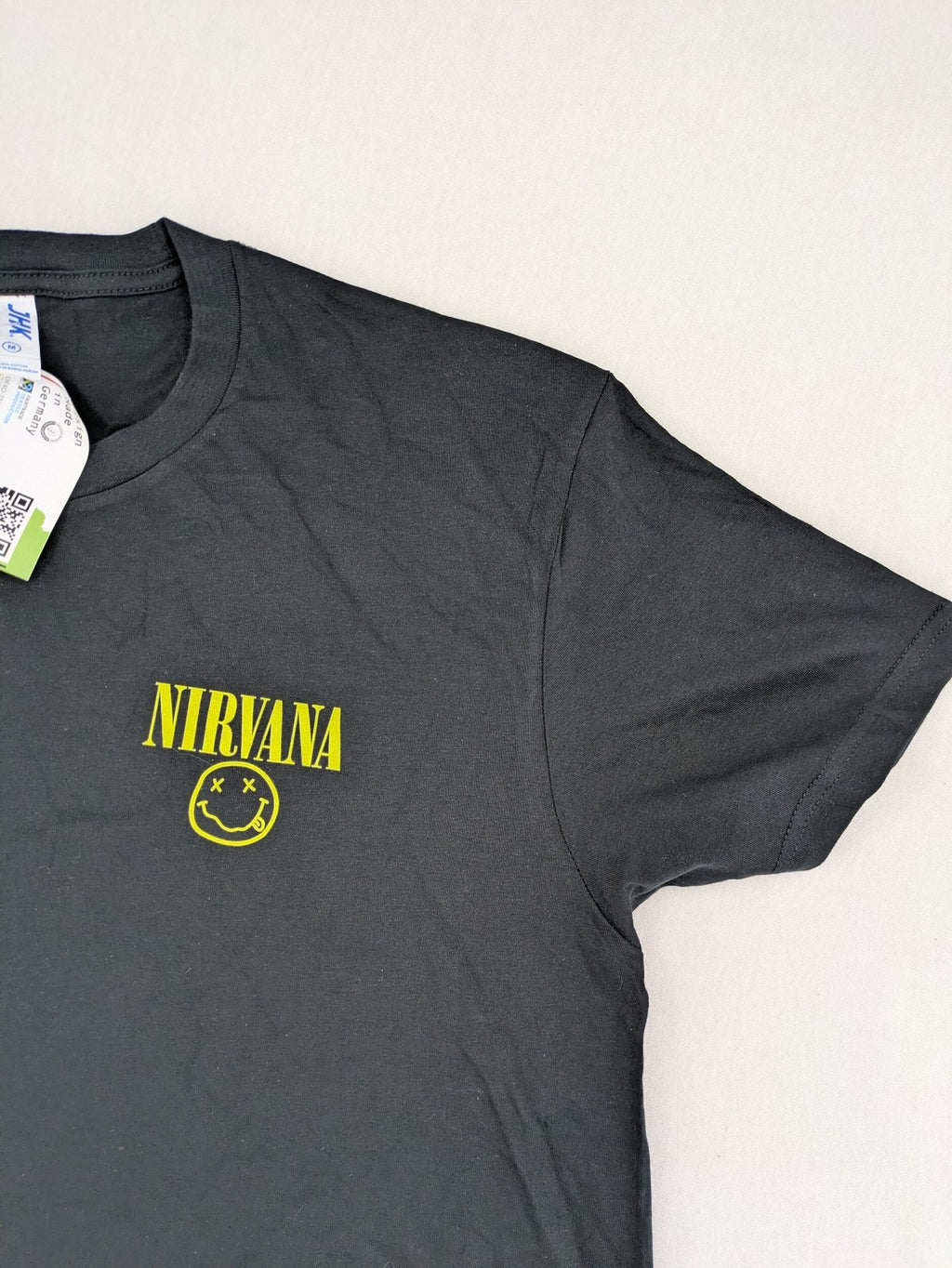 Smiley grey band t-shirt featuring yellow Nirvana smiley face logo on chest.