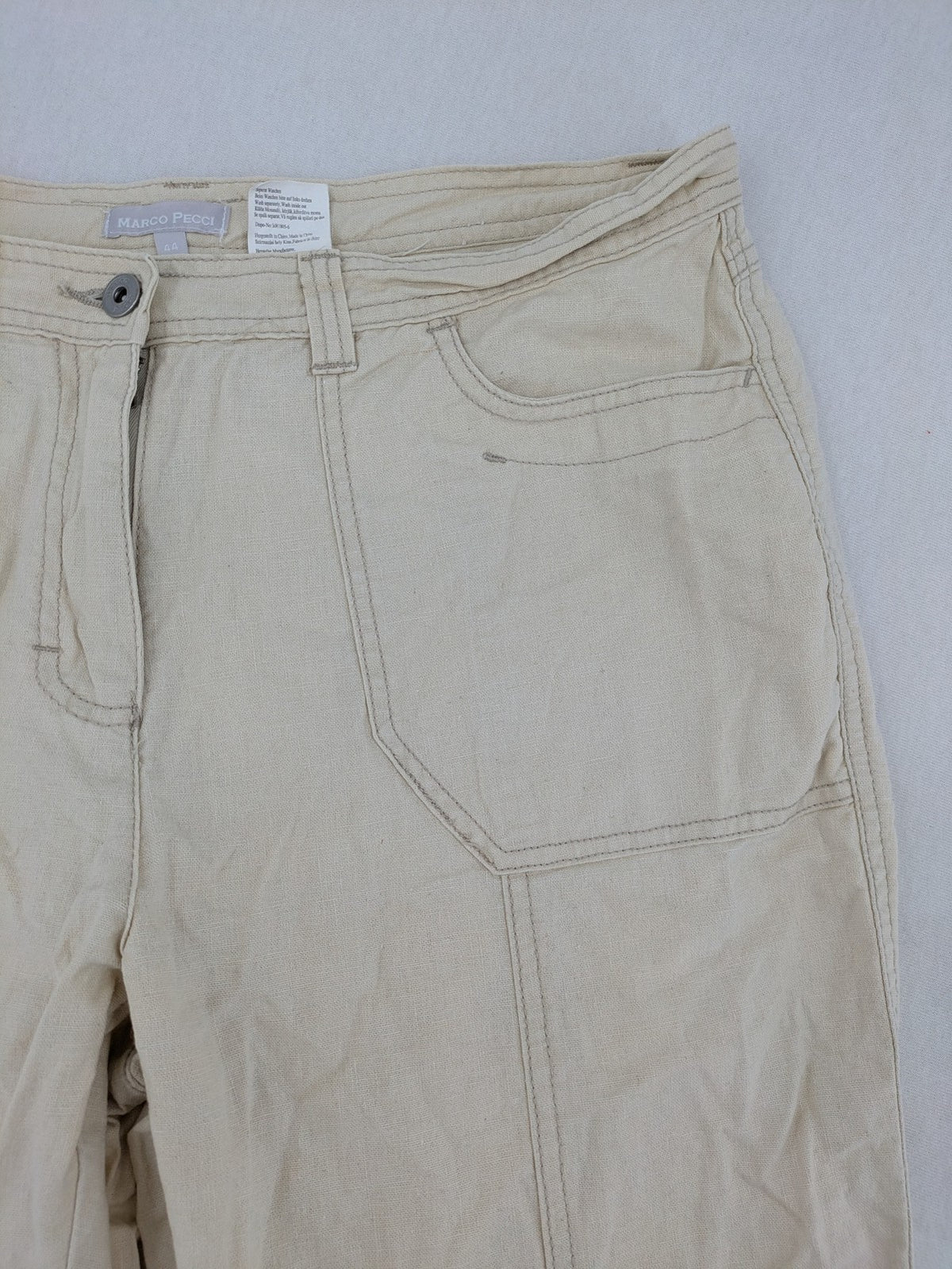 Marco Pecci beige capri pants with prominent seam details and practical pockets.