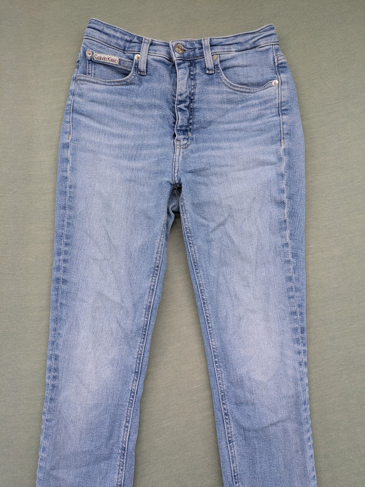 Calvin Klein Jeans blue high rise super skinny ankle jeans with logo patch and stretch material.