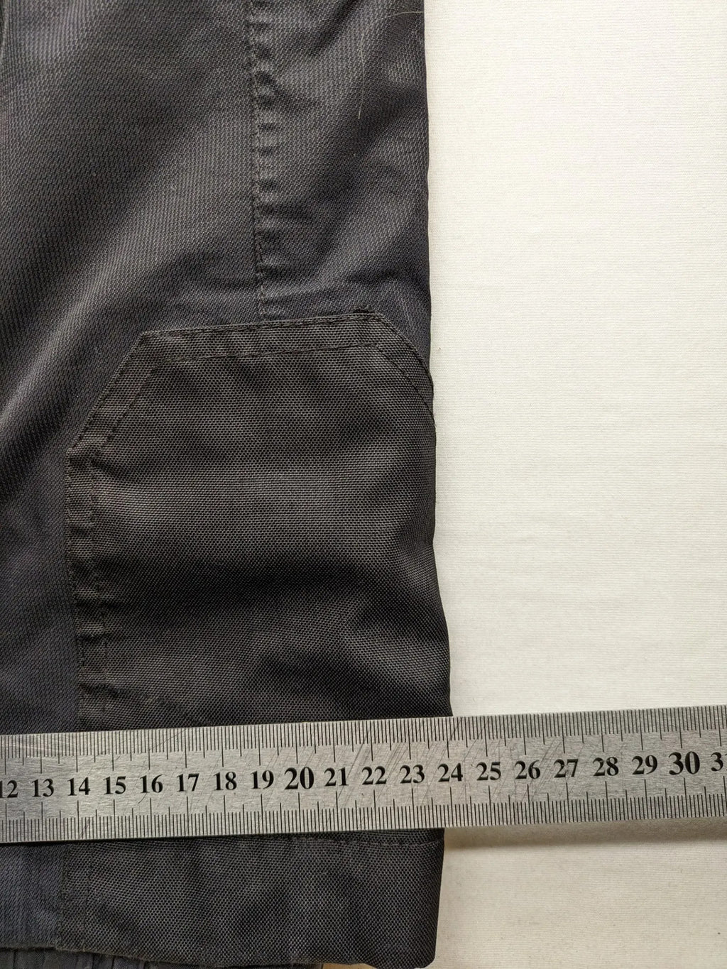 Schoffel black ski pants with adjustable straps, zip pockets, and snow gaiters.